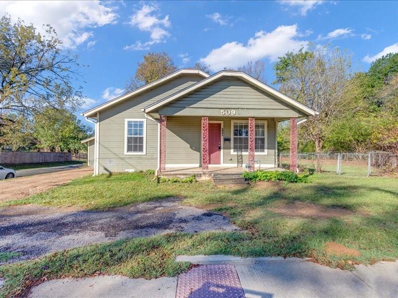 front view of a house with a yard