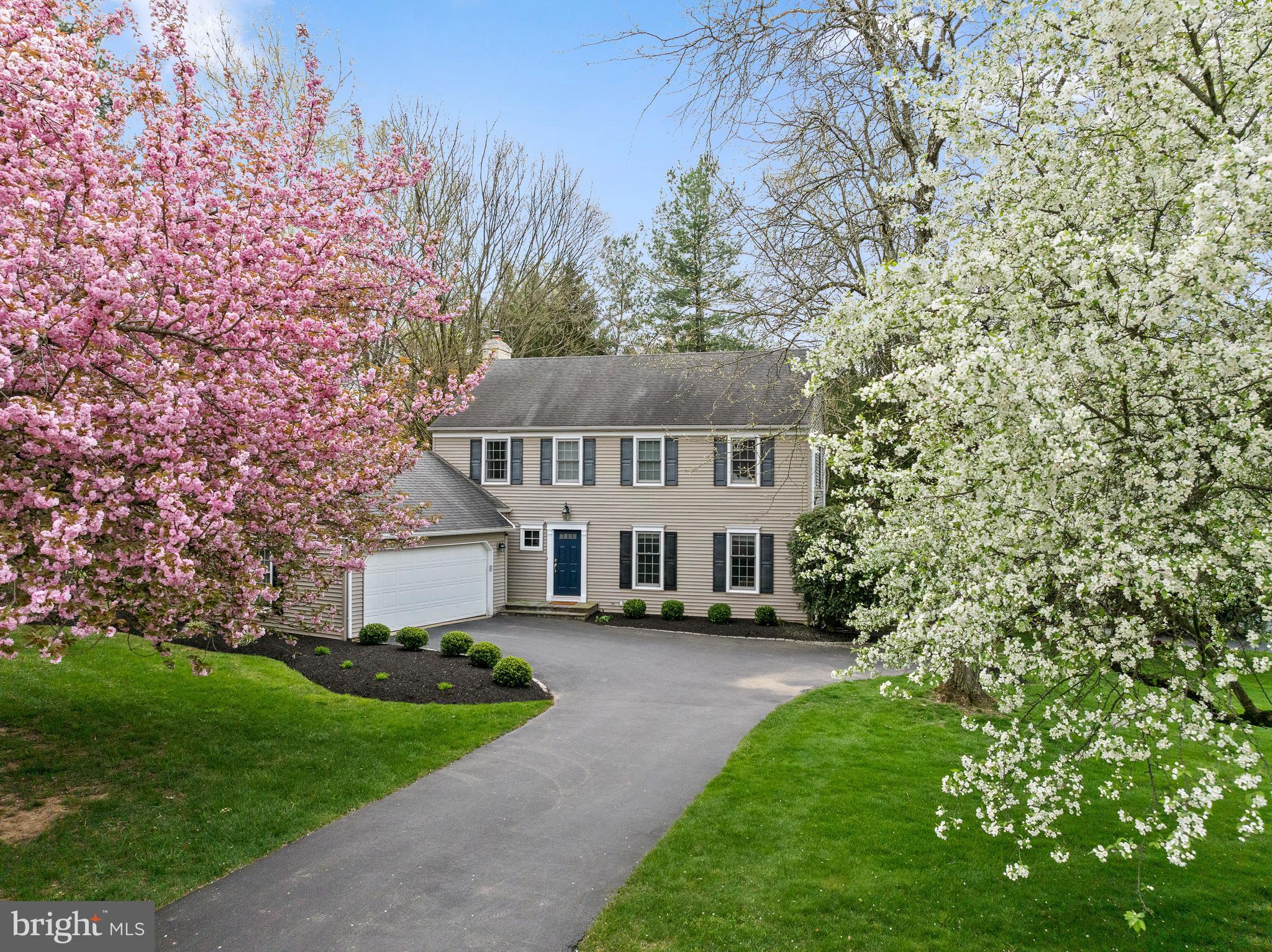 a view of house with outdoor space and garden