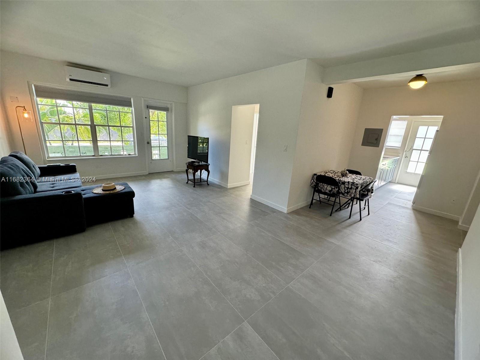 a living room with furniture and a couch