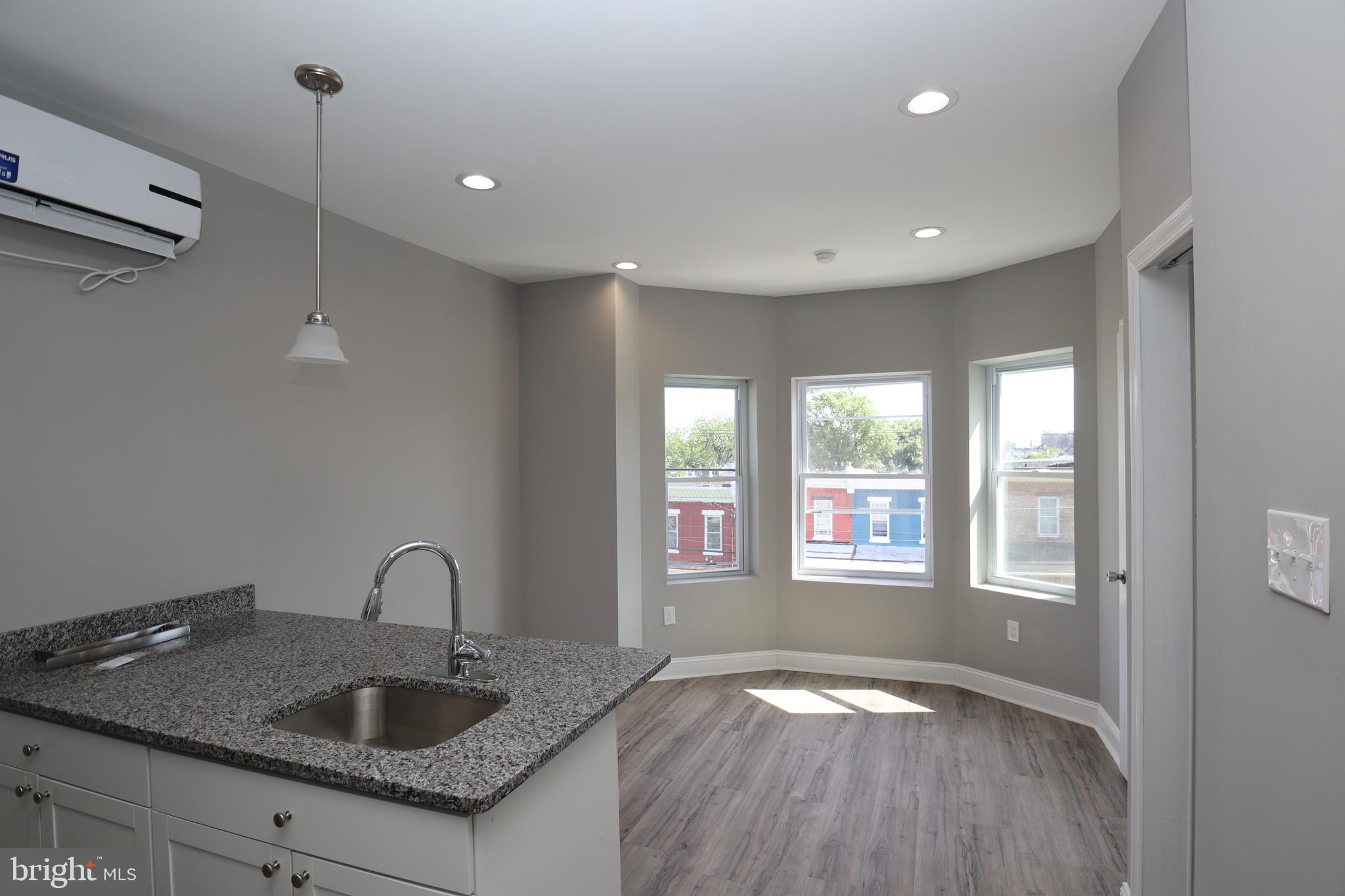 a kitchen with sink and window