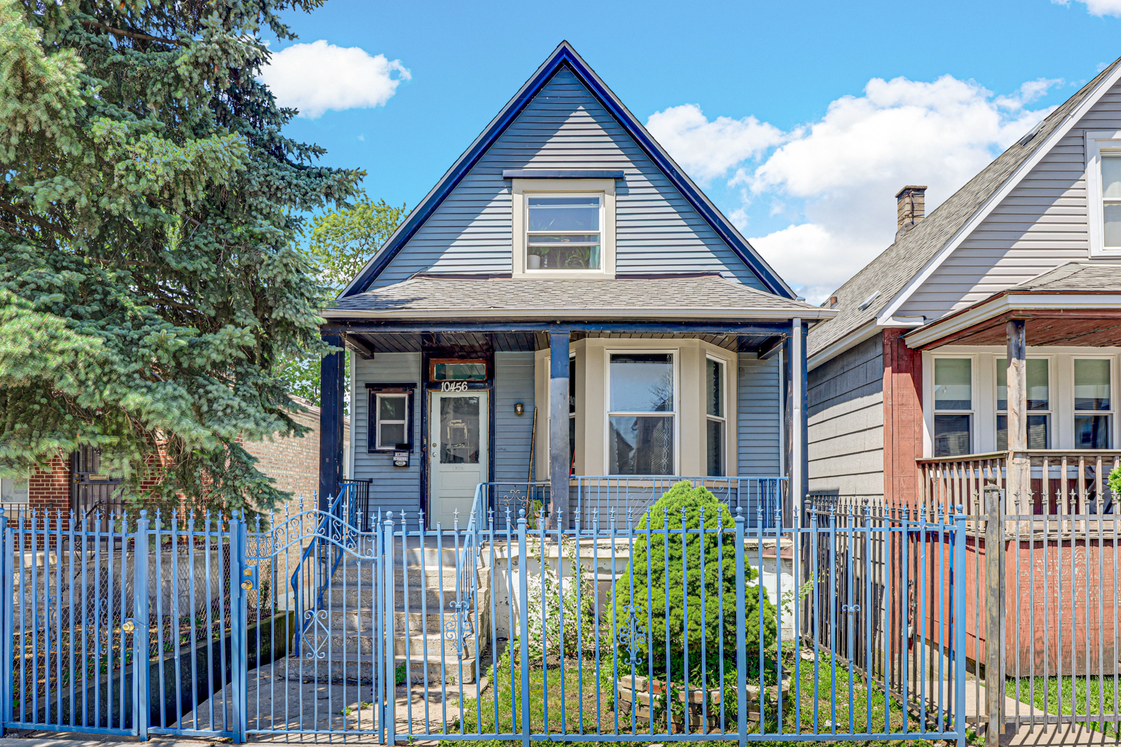 front view of a house with a small yard