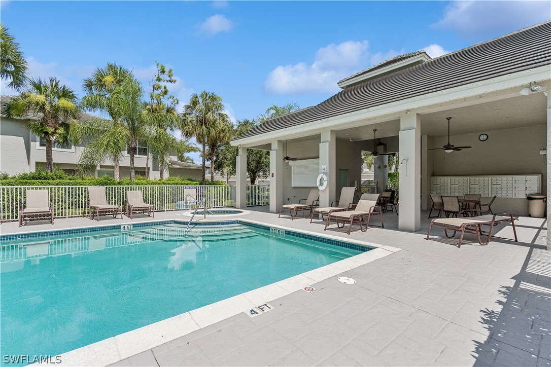 a view of a house with swimming pool and sitting area