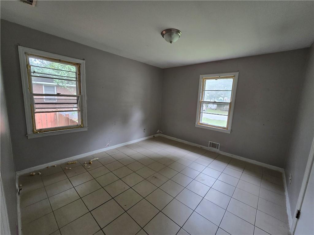 a view of an empty room and window