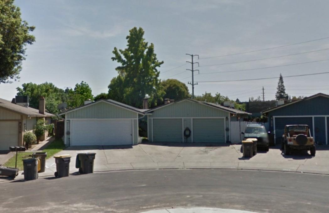 a front view of a house with garage