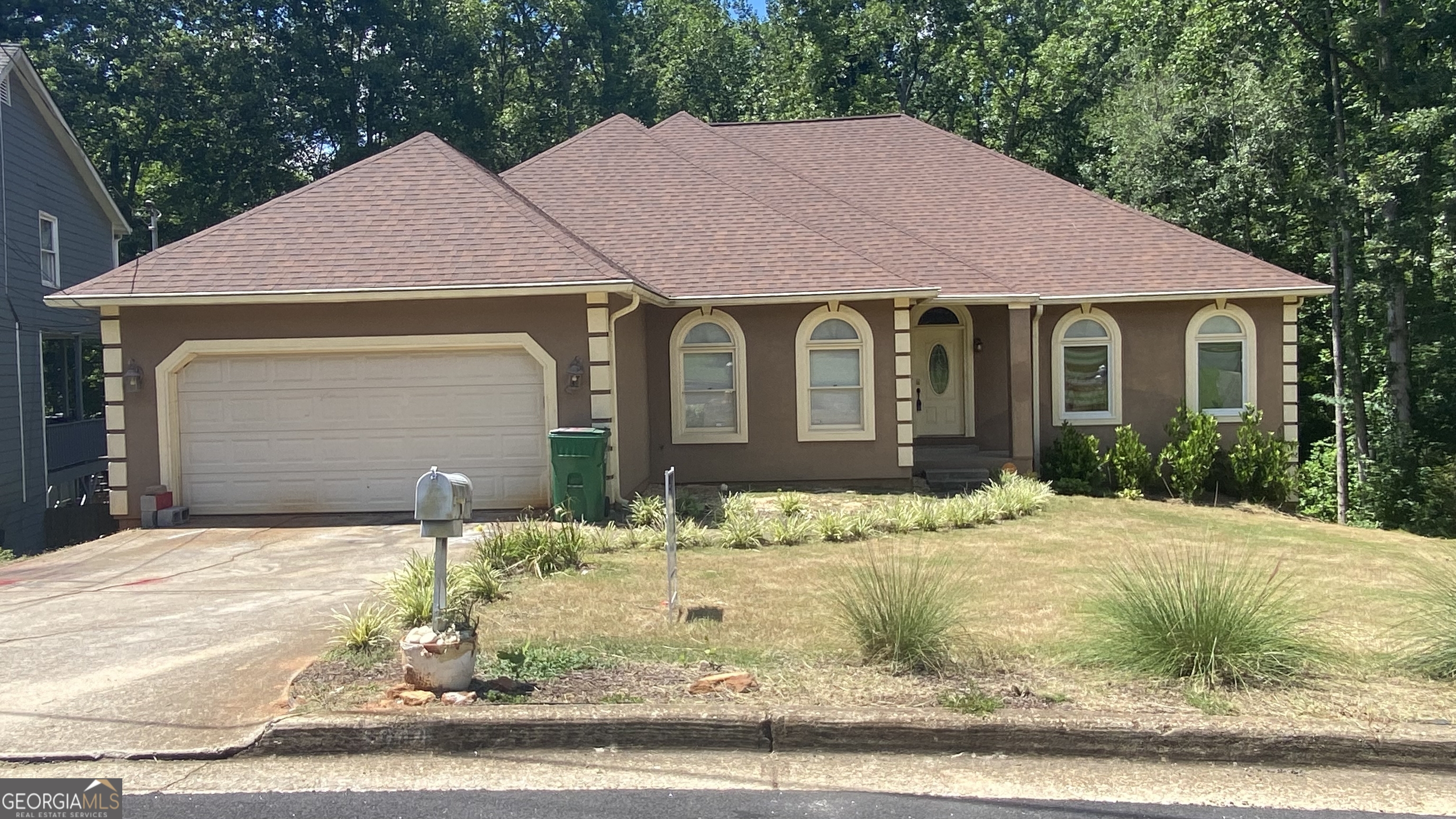 a front view of a house with a yard