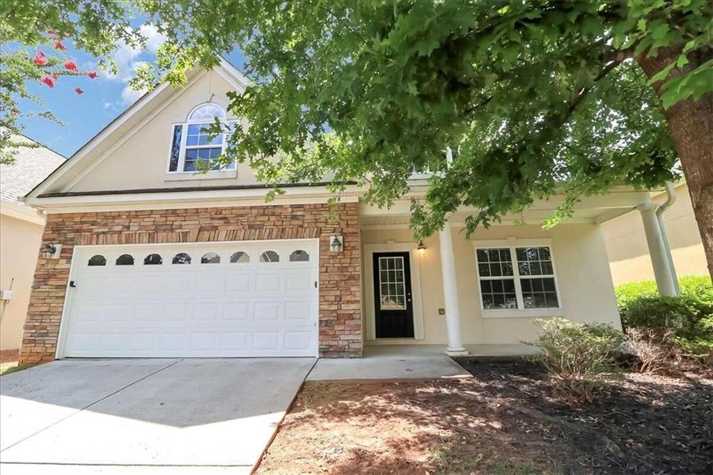 a front view of a house with a garage