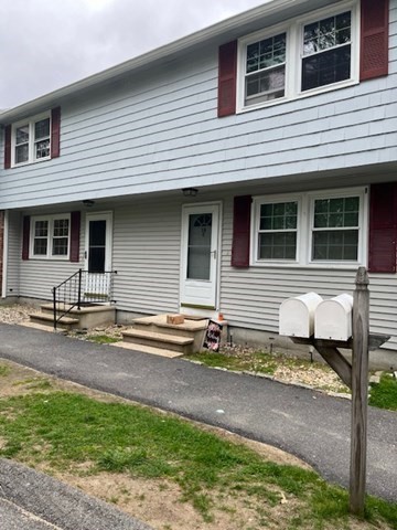 a front view of a house with yard