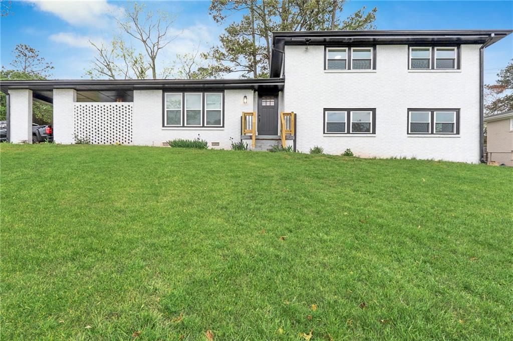 front view of a house with a yard