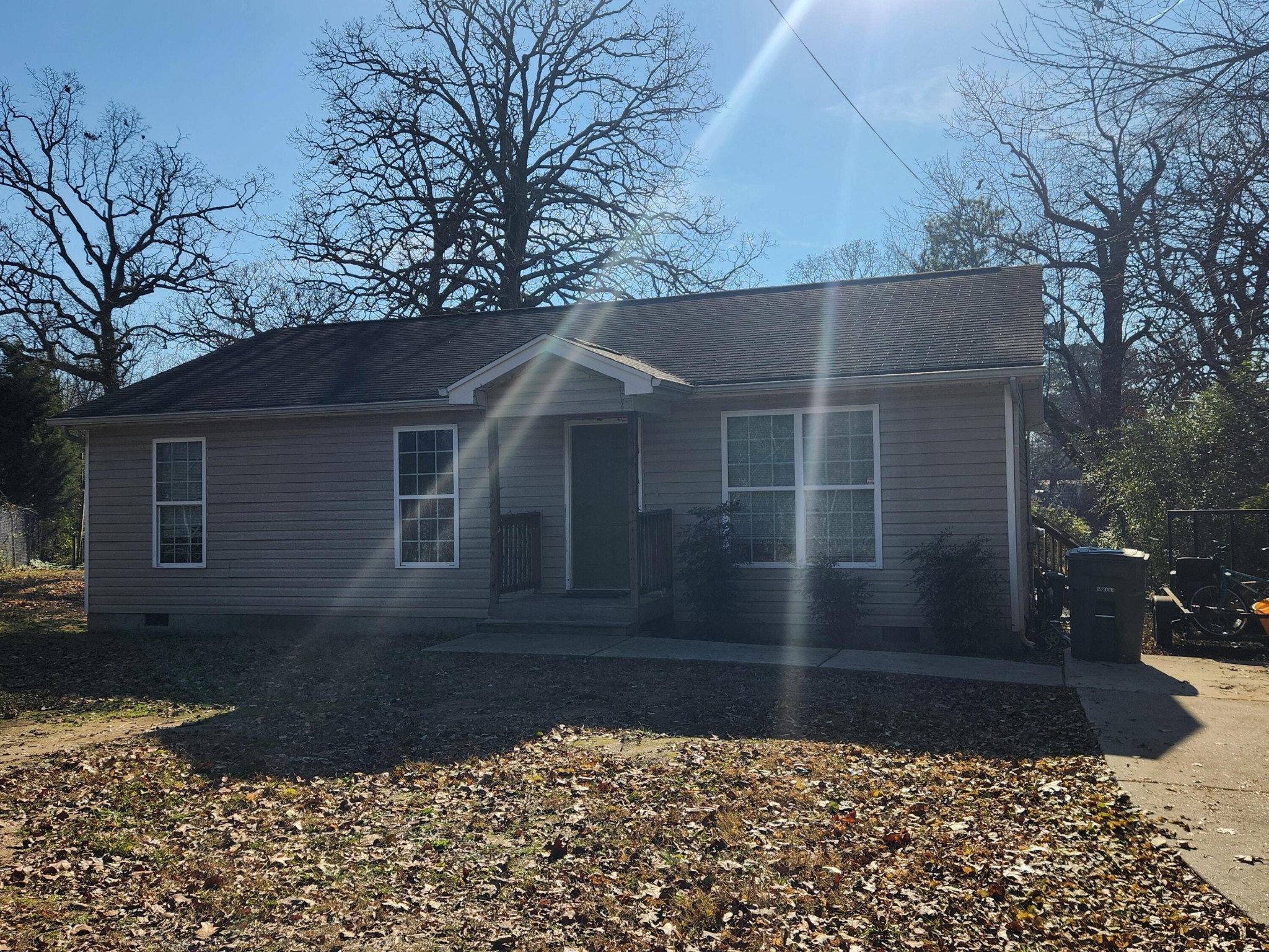 a view of house with a yard