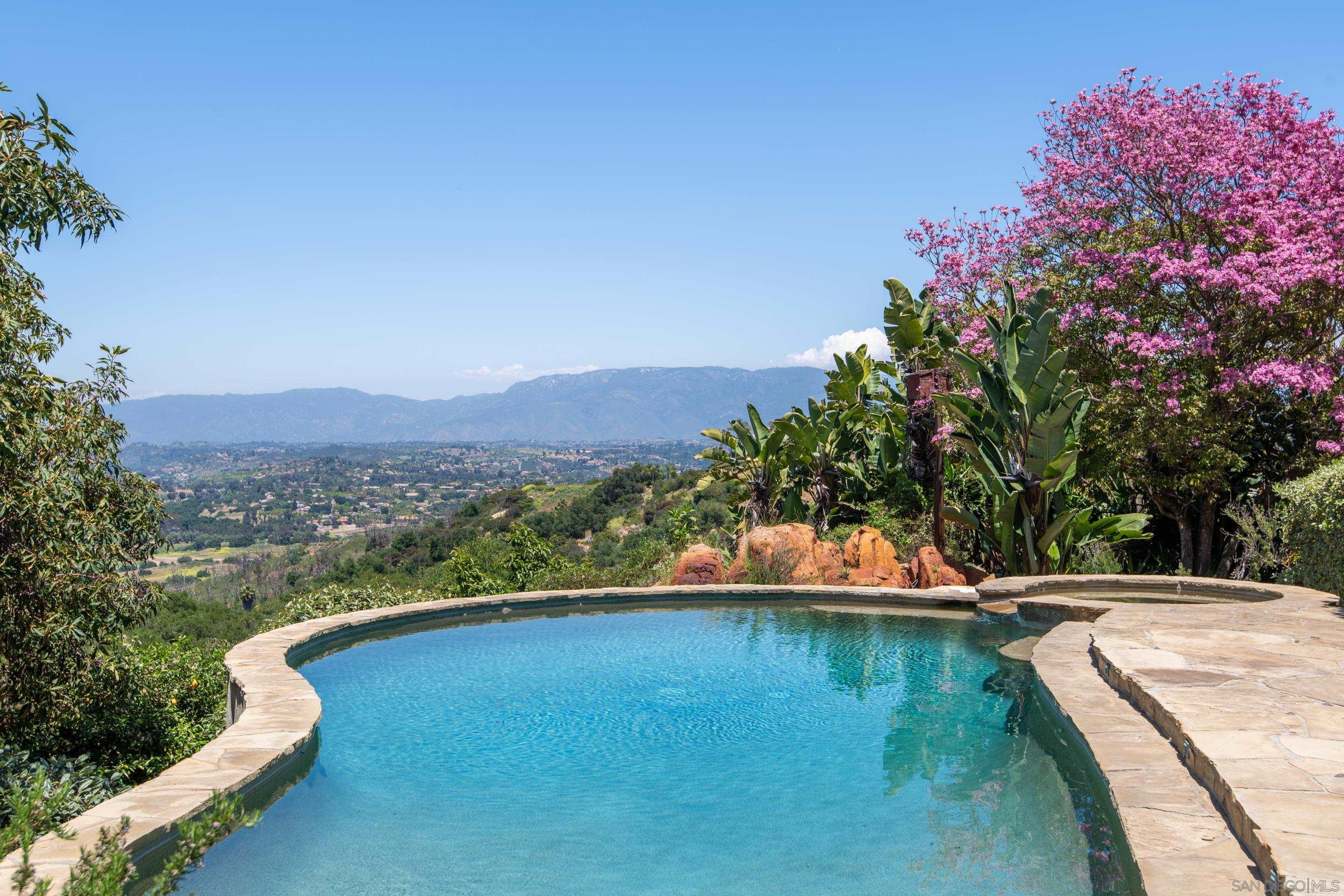 a view of a swimming pool with a lake view