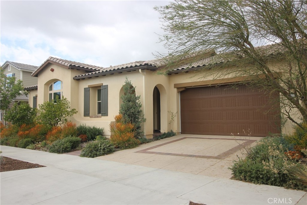 a front view of a house with yard