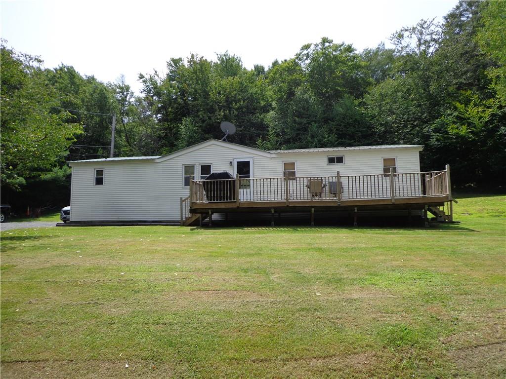 a view of a house with a backyard