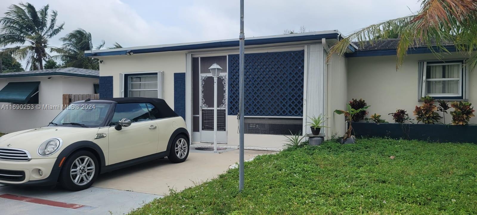 a car parked in front of a house