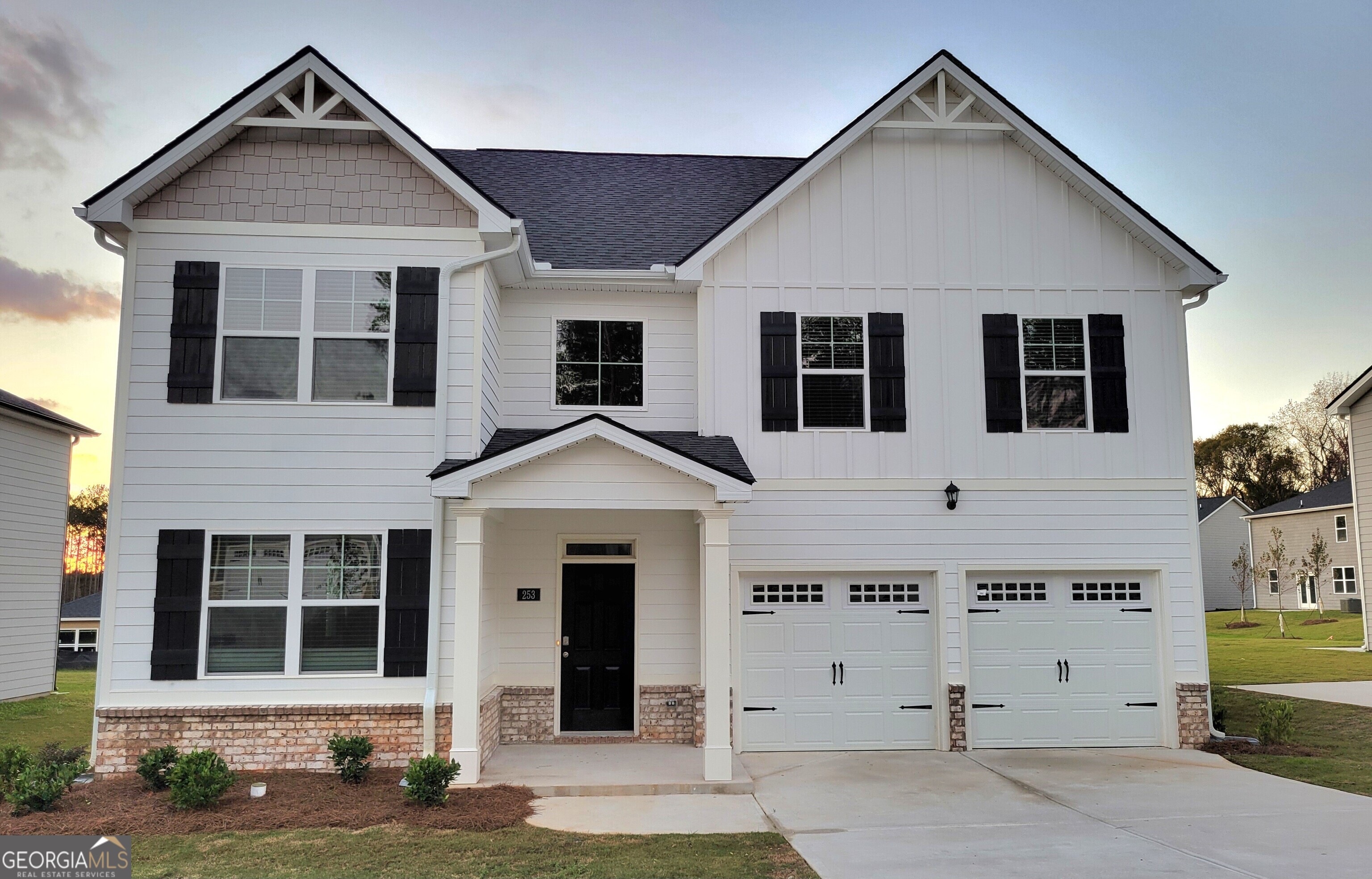 a front view of a house with a garage