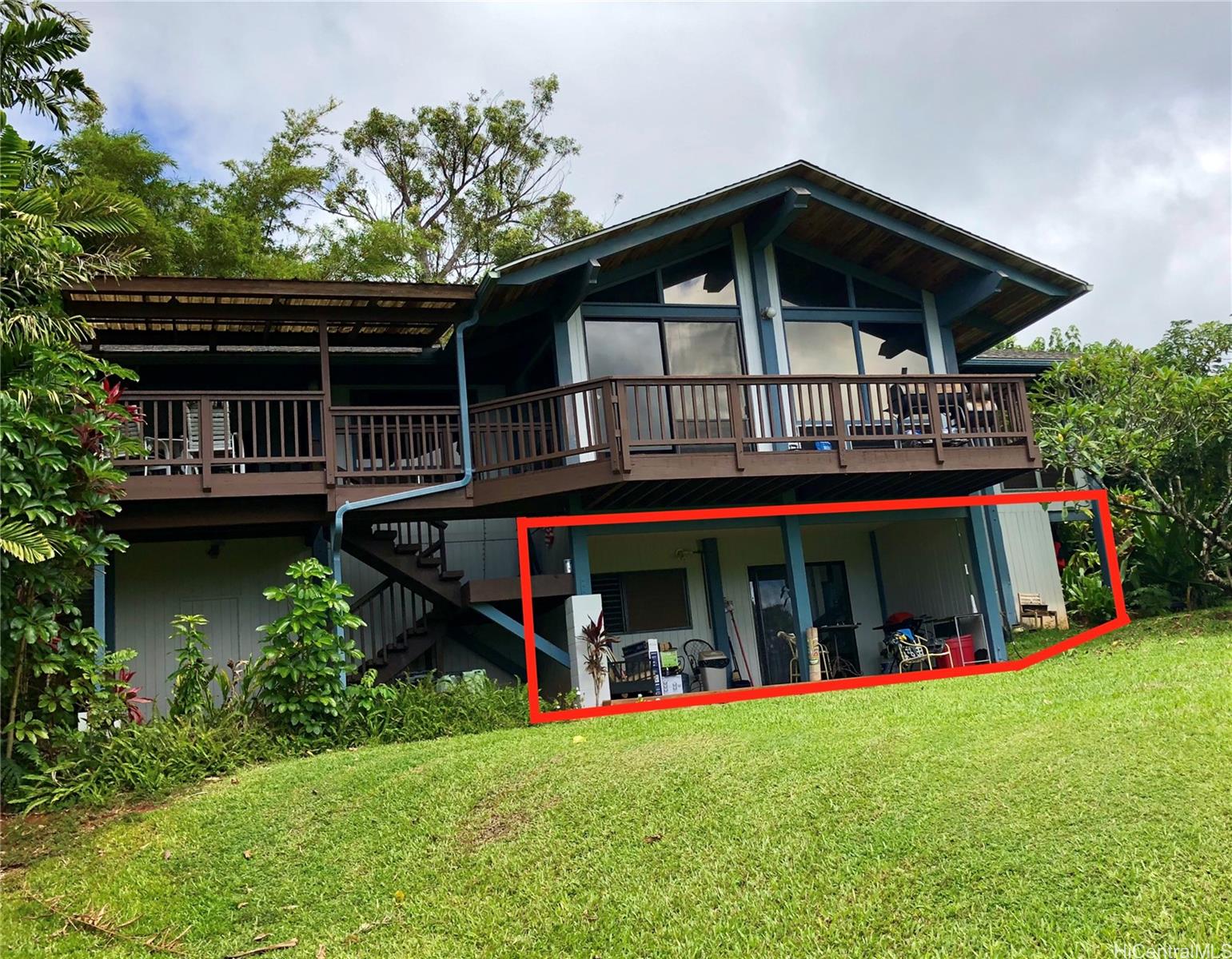 a view of a house with roof deck and sitting area