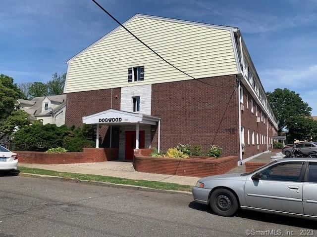 a front view of a house with parking