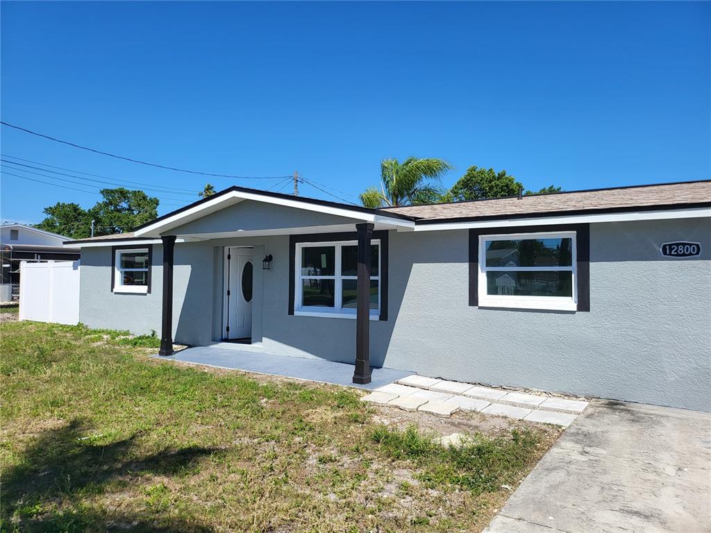 front view of a house with a yard