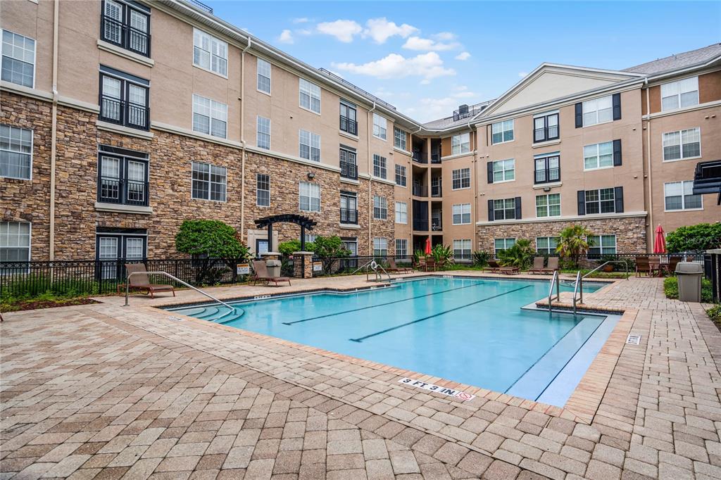 a view of pool with outdoor seating