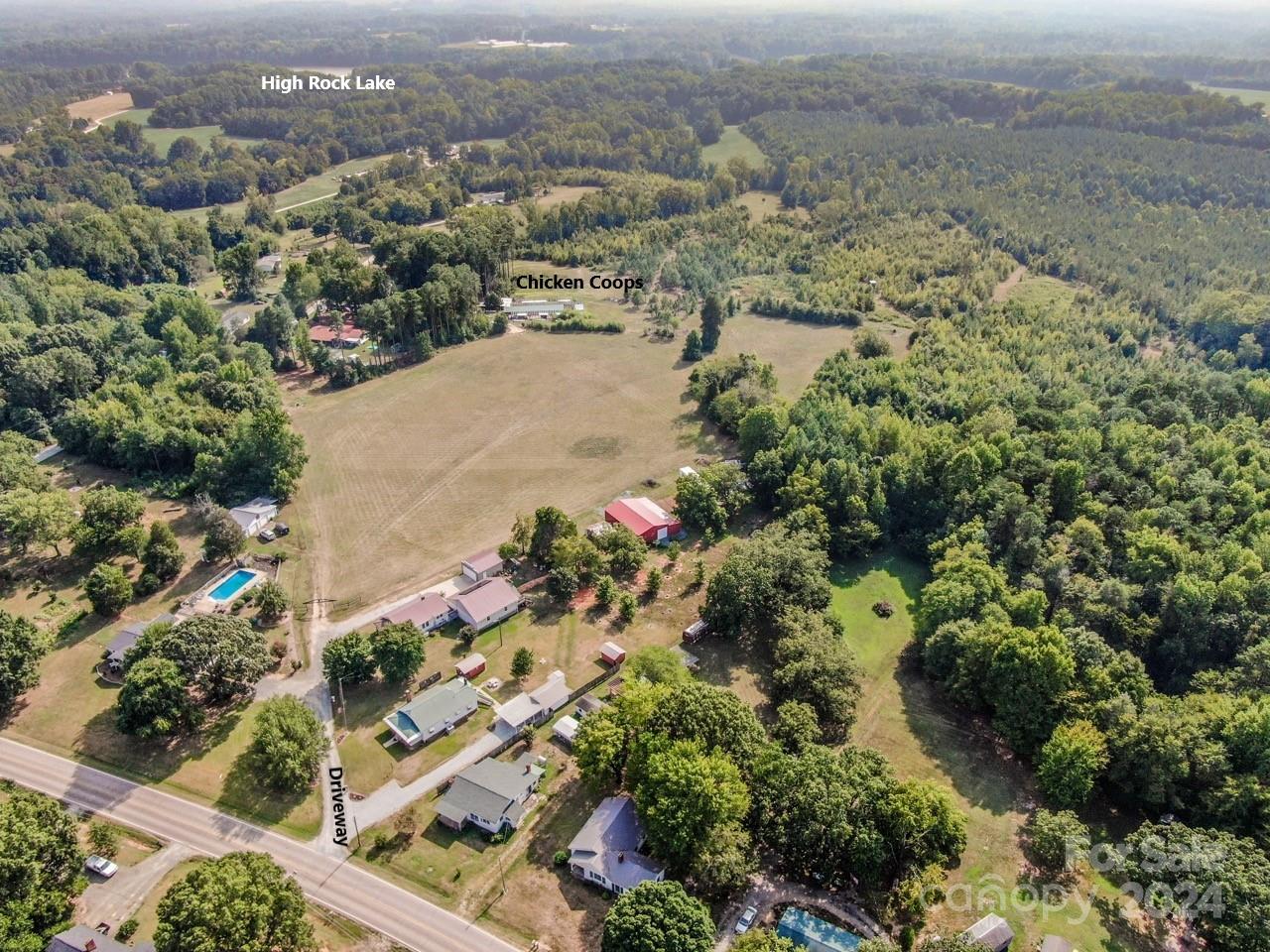 an aerial view of a houses with a yard