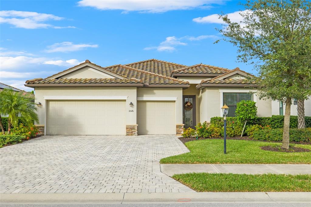 front view of a house with a yard