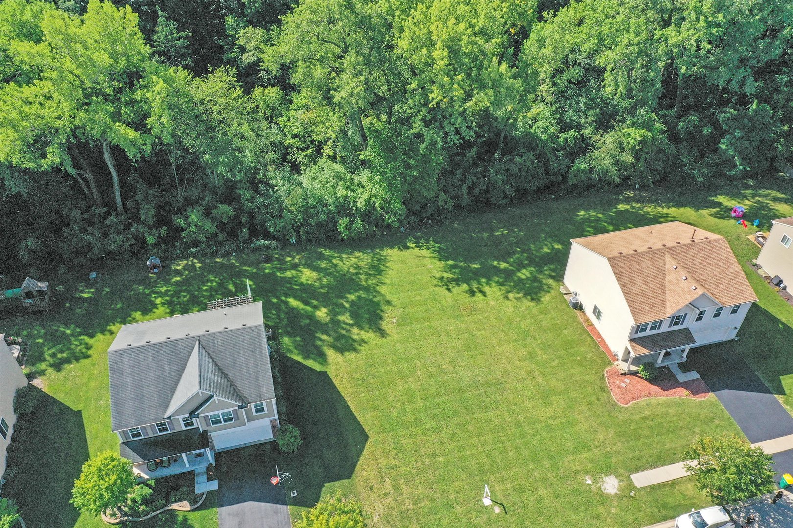 a view of a lake with a yard