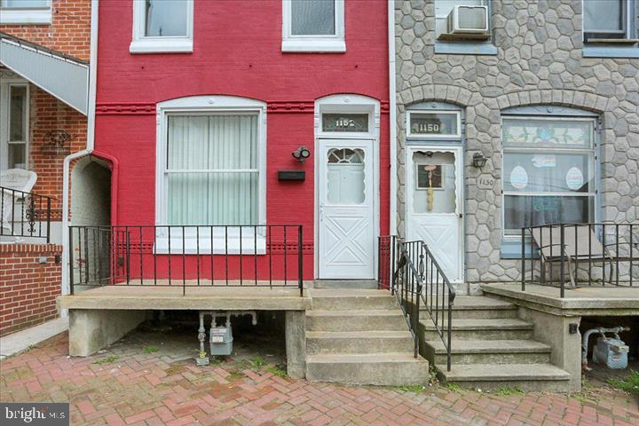 a view of a brick building with a bench