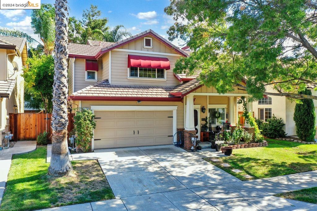 a view of a house with a yard and plants