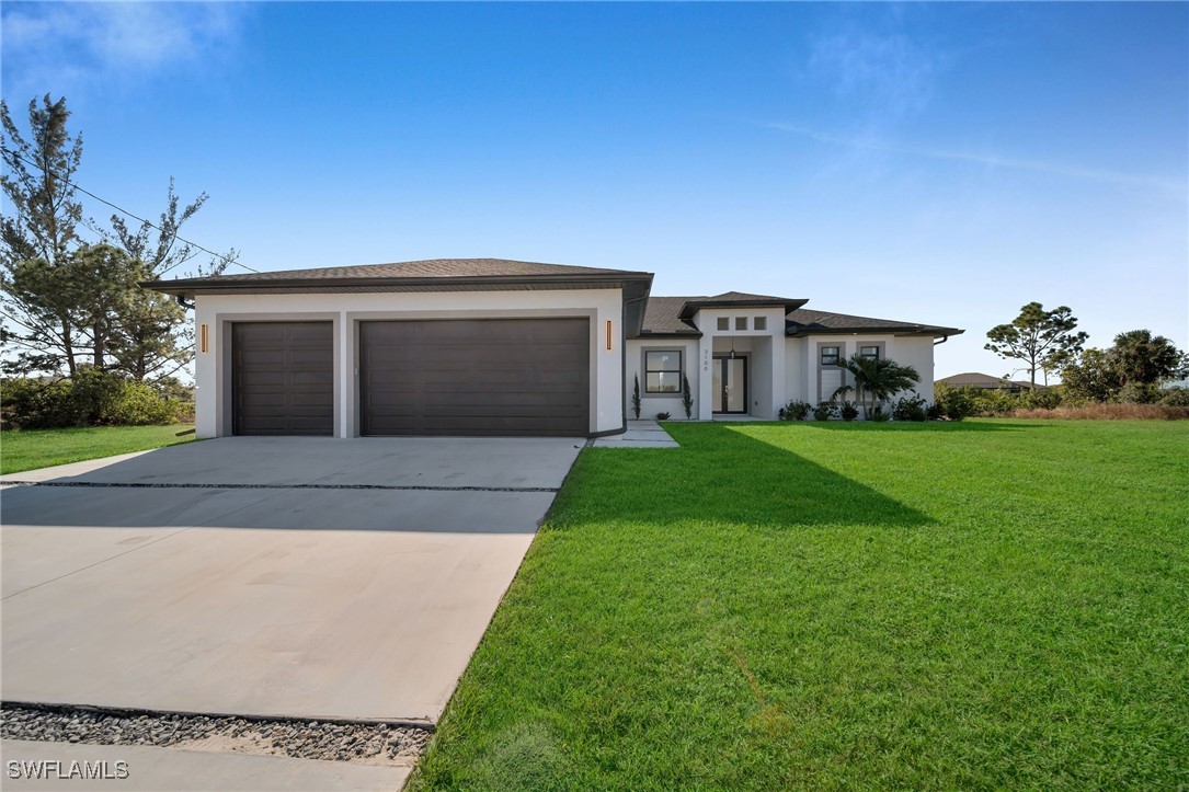 a front view of house with yard and green space