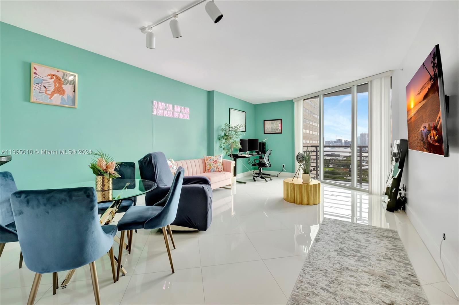 a living room with furniture and a flat screen tv