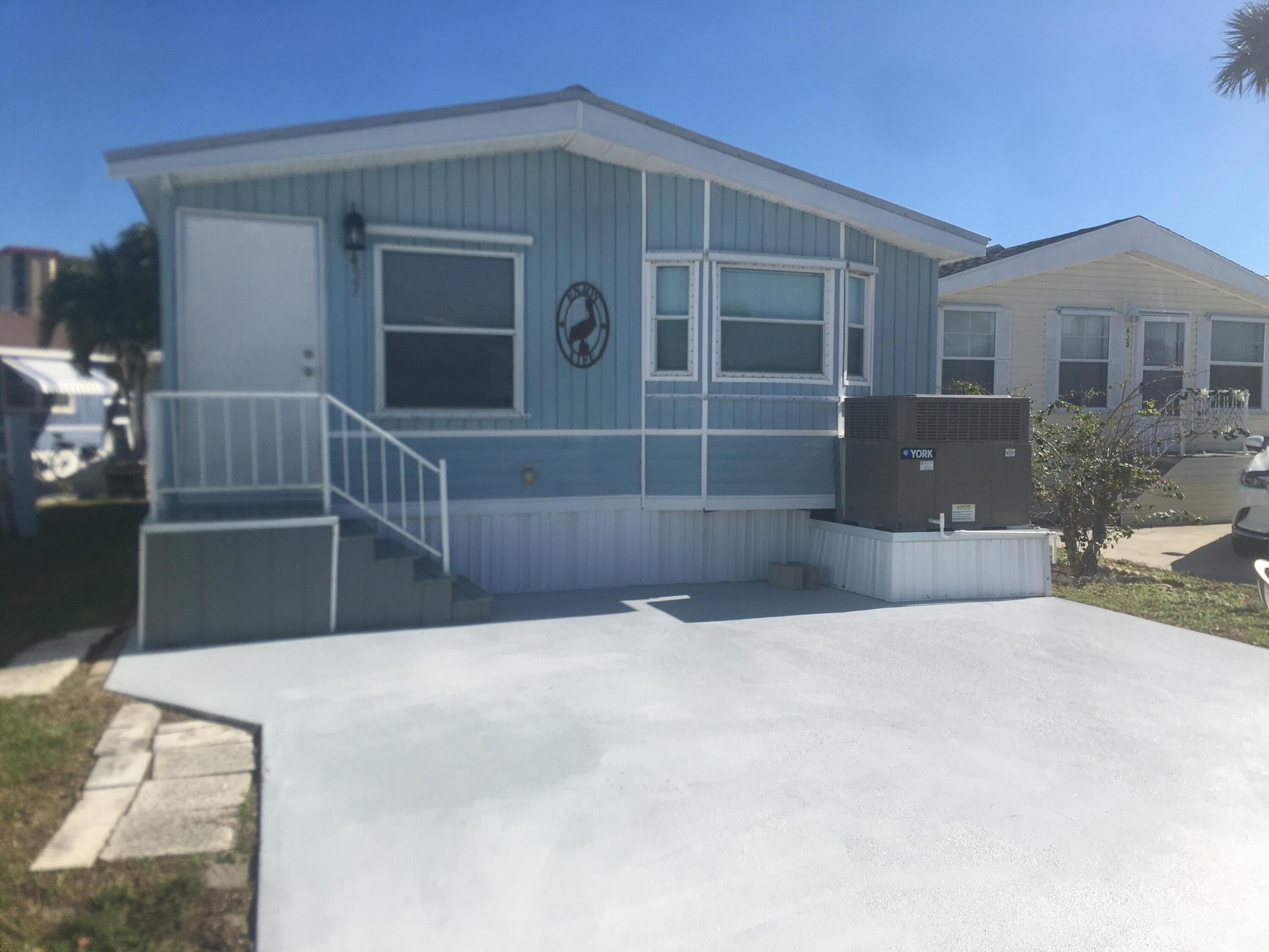 a view of front door and yard