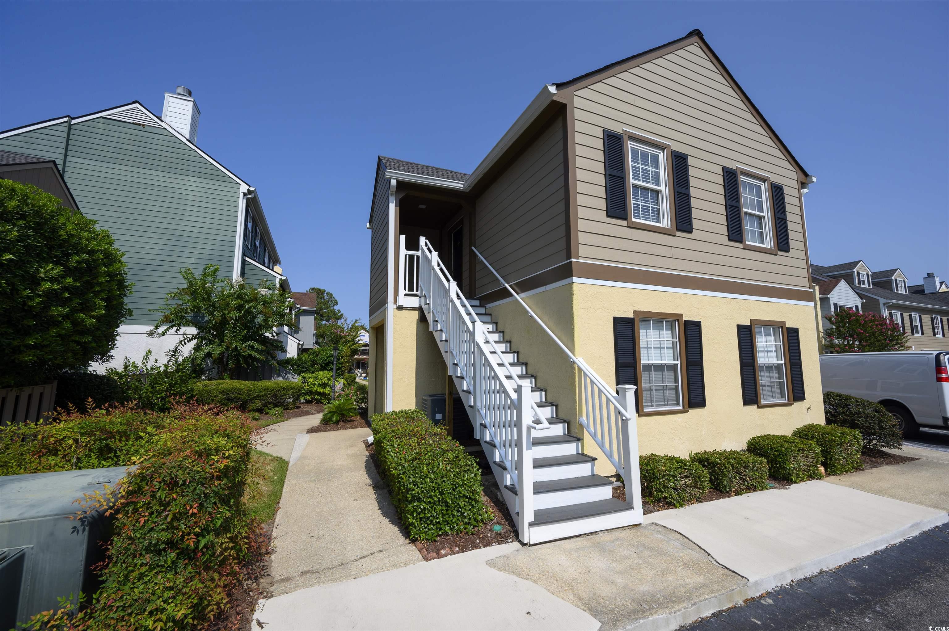 View of property with central AC unit