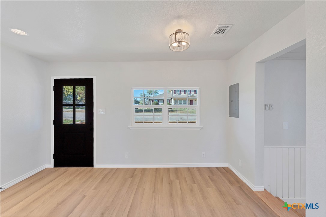 a view of an empty room with a window