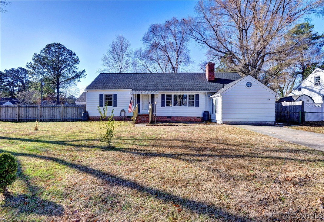 Single story home featuring a front yard