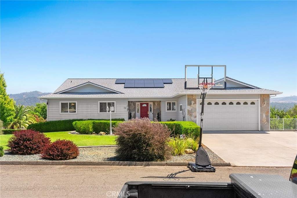 a front view of house with yard and green space