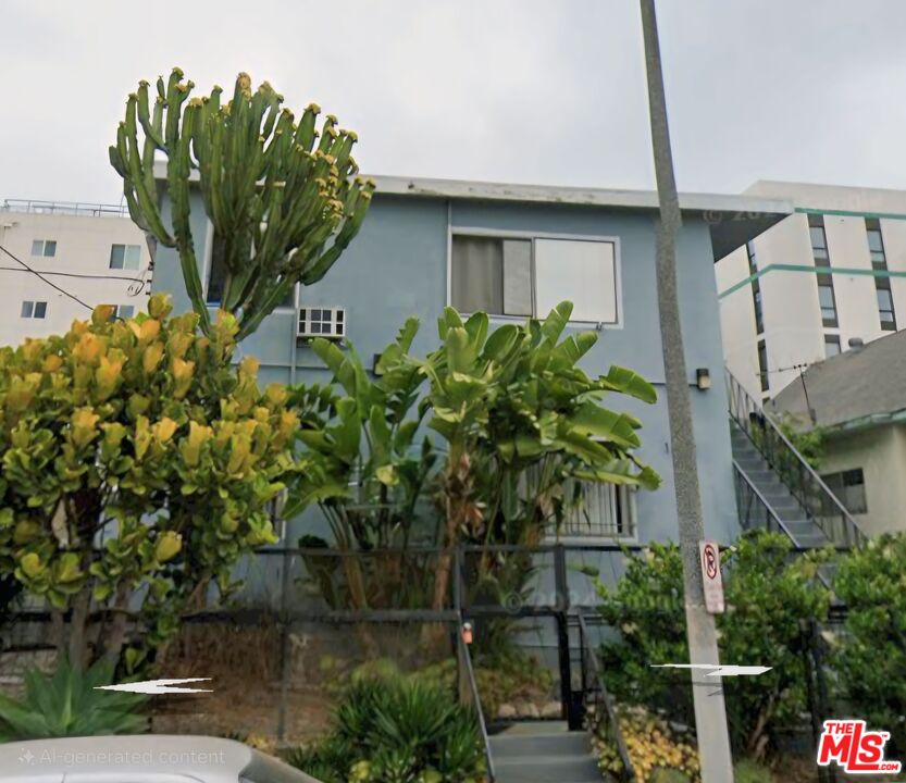 a plant that is sitting in front of a house