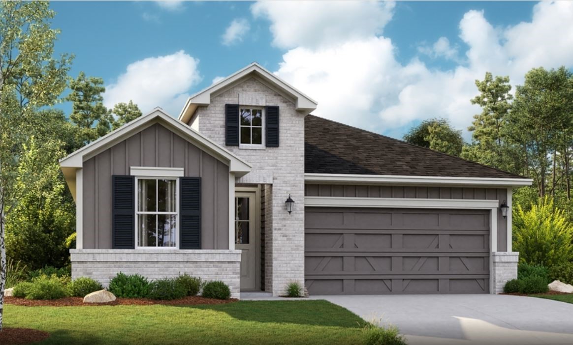 a view of a house with a yard and garage