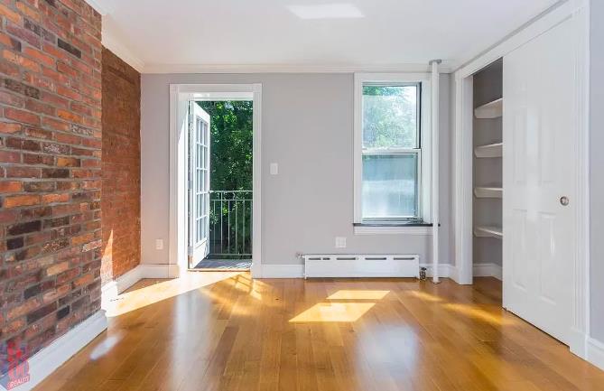 a view of a bathroom with tub and window