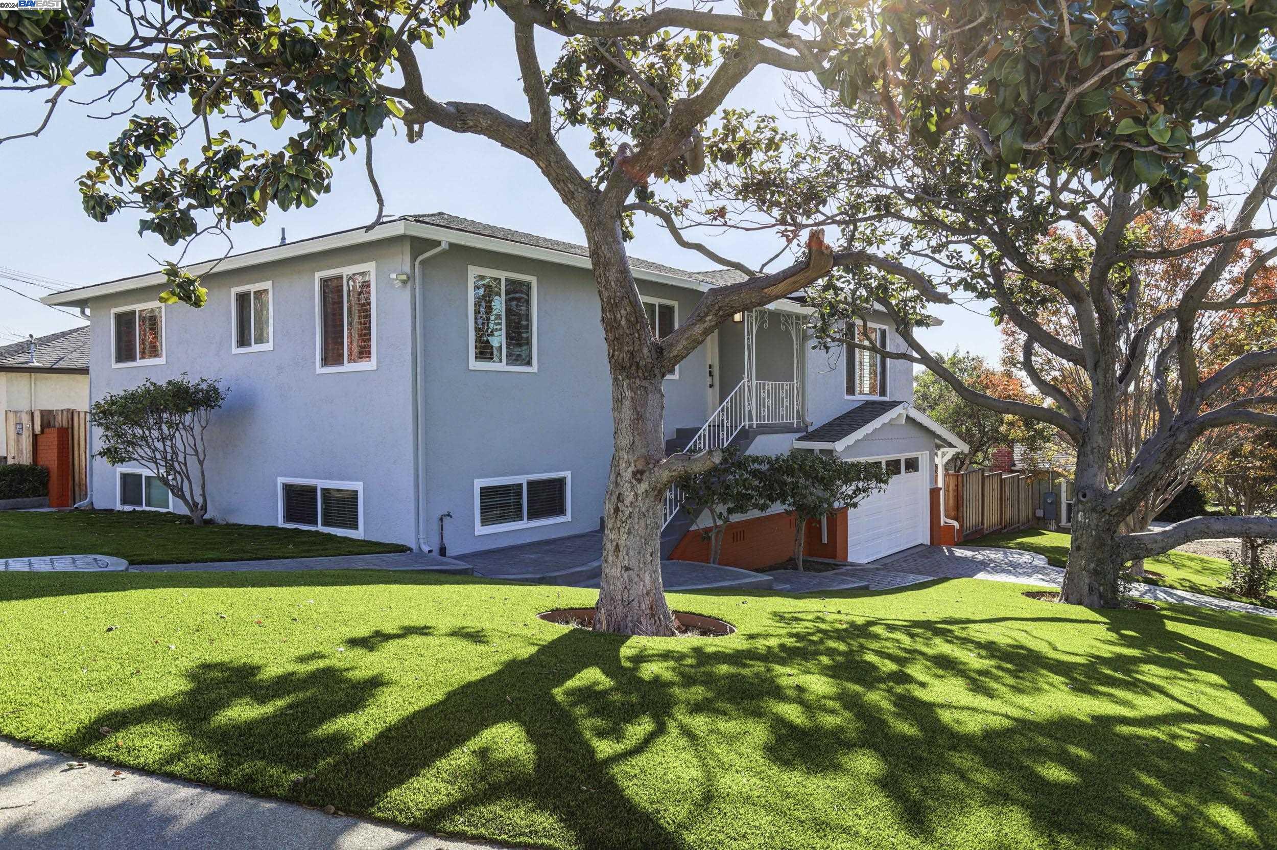 a front view of a house with a yard