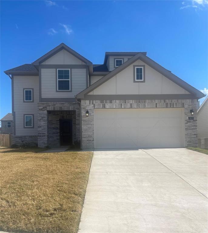 a front view of a house with yard