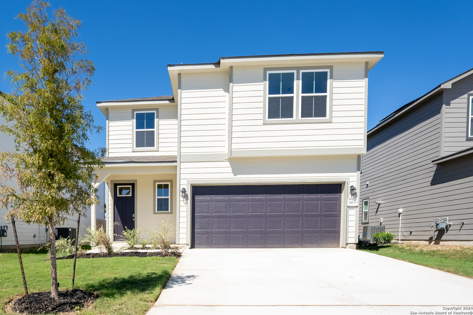 a front view of a house with a yard