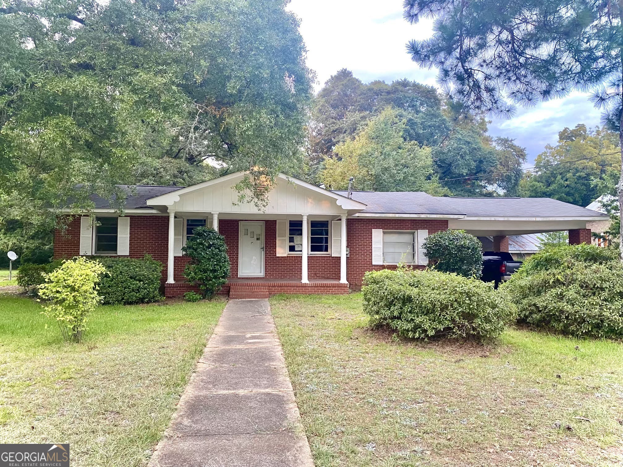 front view of a house with a yard