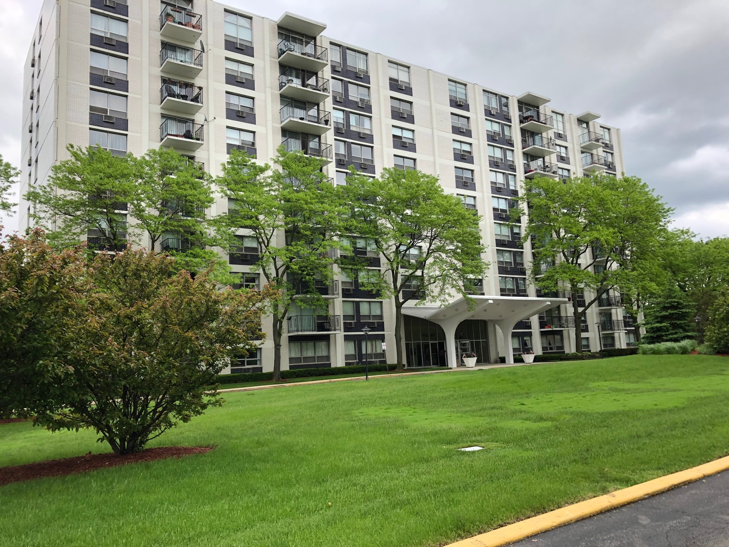 a large building with a yard in front of it