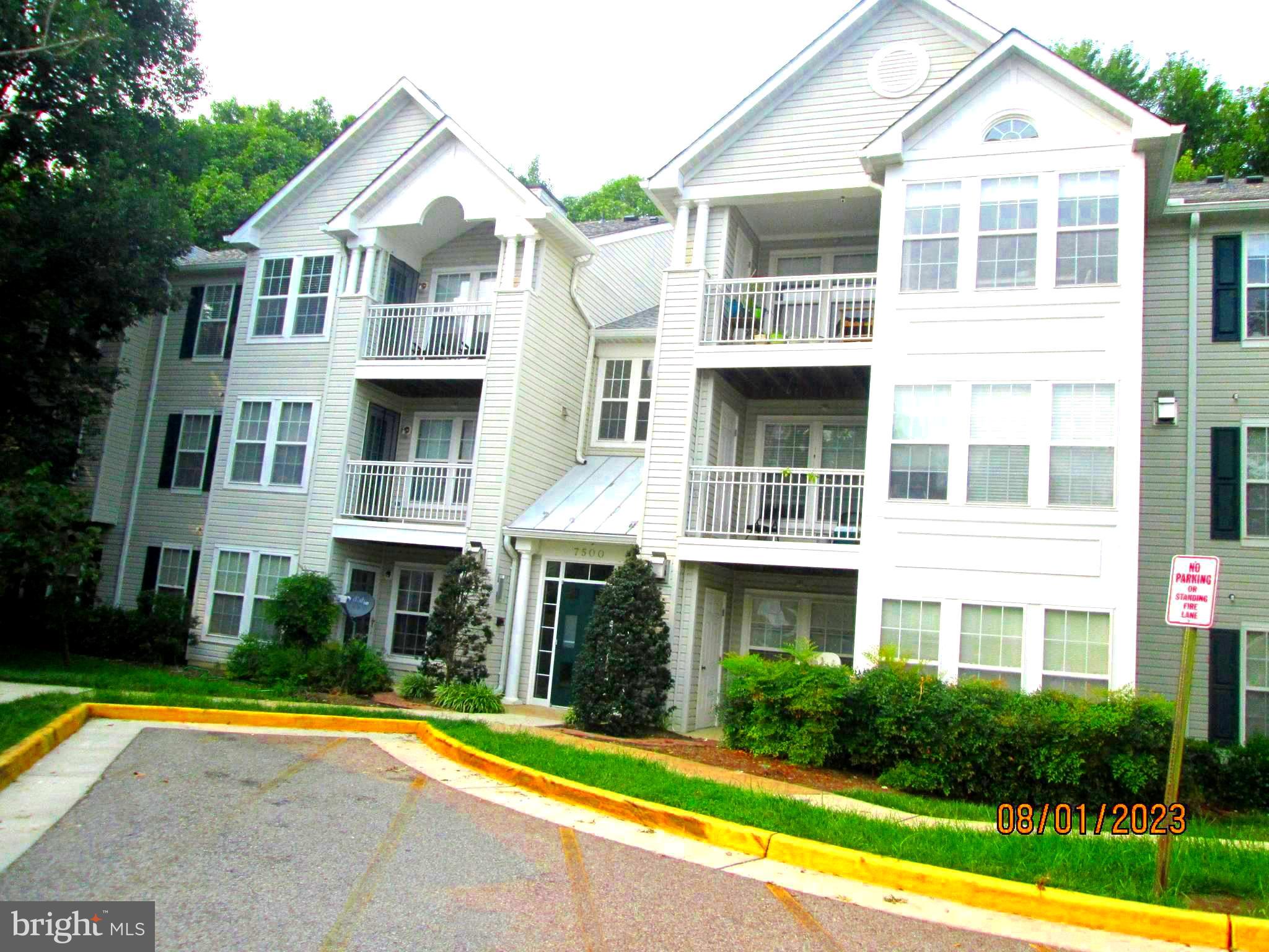 a front view of a house with swimming pool and porch