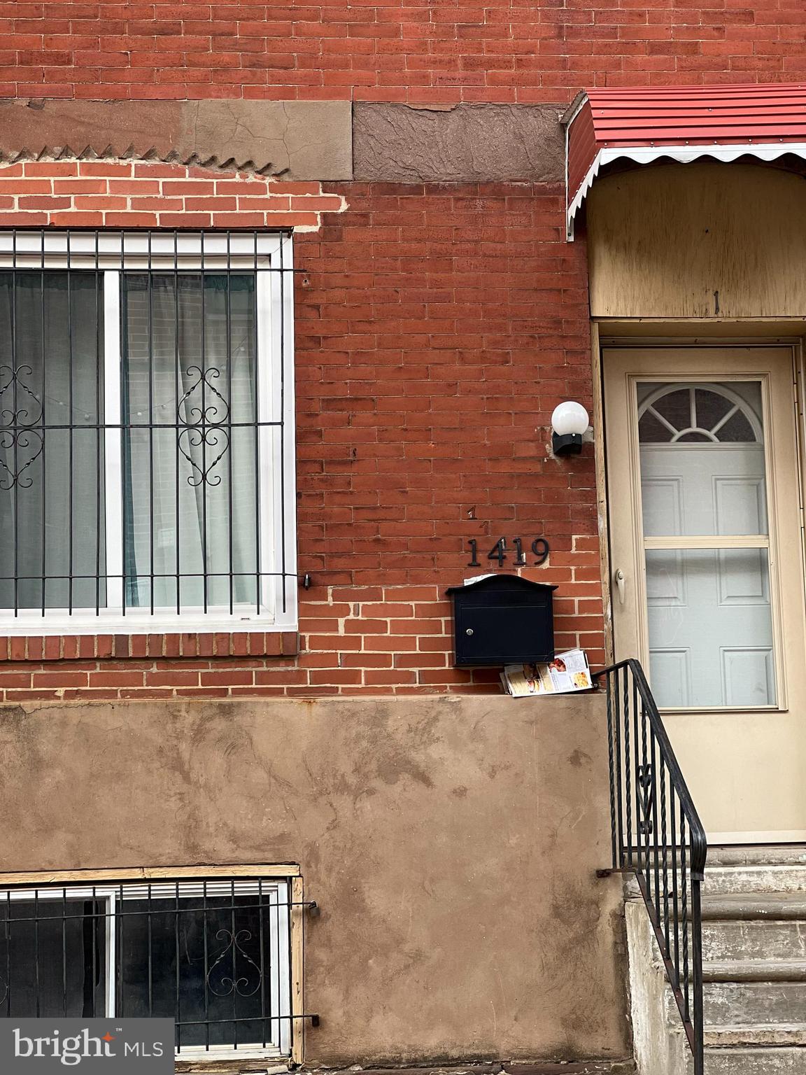 a view of a house with a door and a window