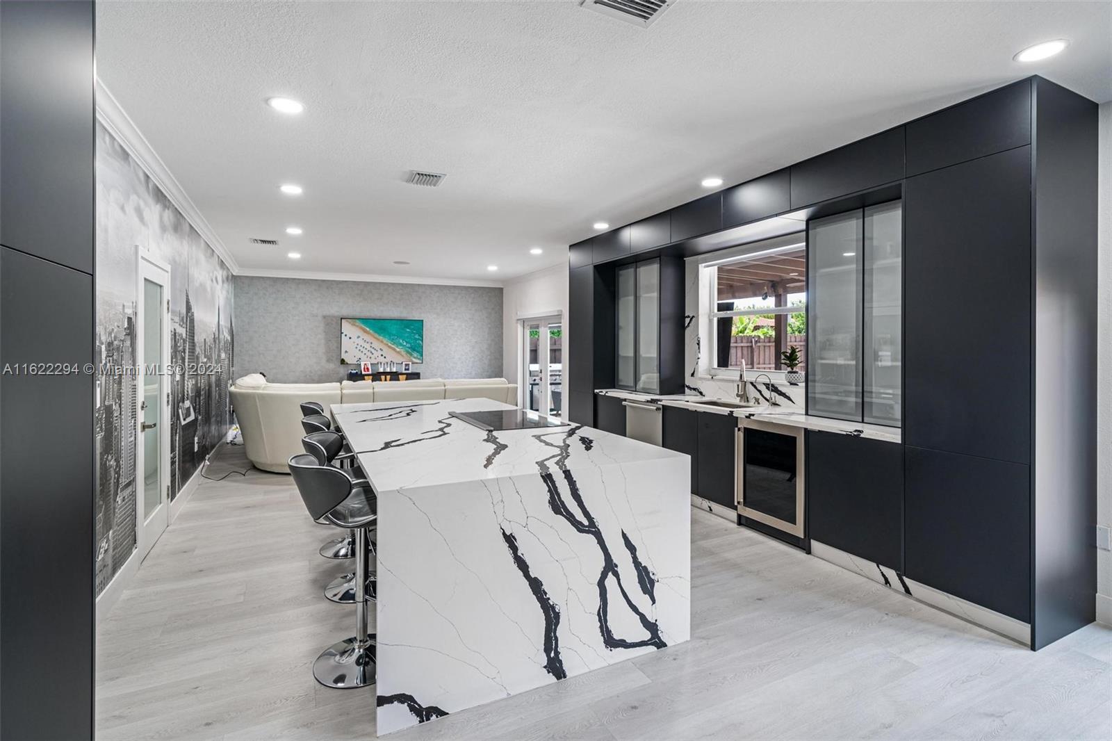 a large kitchen with a table and chairs