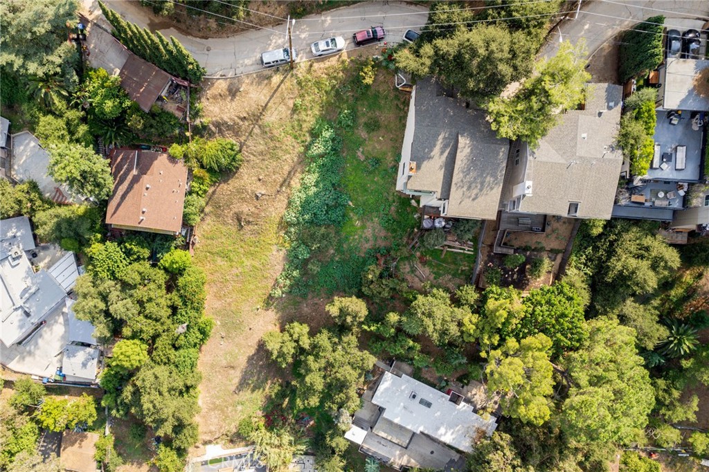 an aerial view of a house with a yard