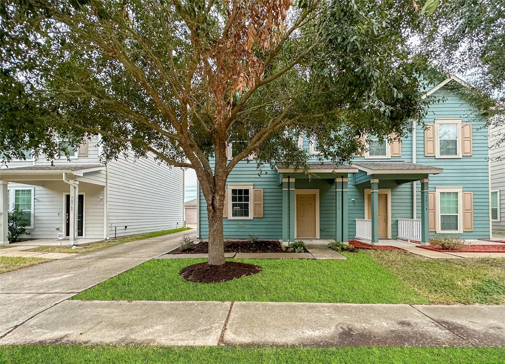 front view of a house with a yard