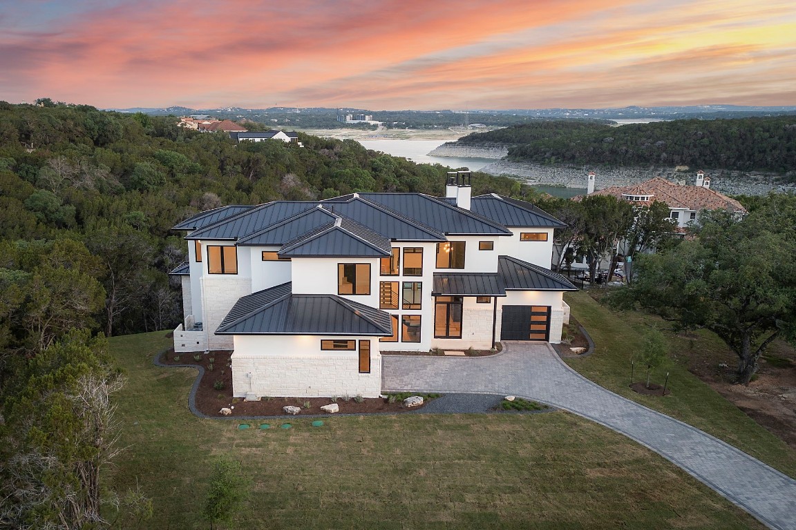 Behold the awe-inspiring aerial vista of a newly constructed modern beauty away from the hustle and bustle. With a backdrop of majestic canyon views and the tranquil expanse of the lake, this home offers a rare blend of natural beauty and modern luxury. Surrounded by peace and privacy, immerse yourself in the serenity of this exclusive retreat, where every moment is a testament to the harmonious fusion of elegance and nature