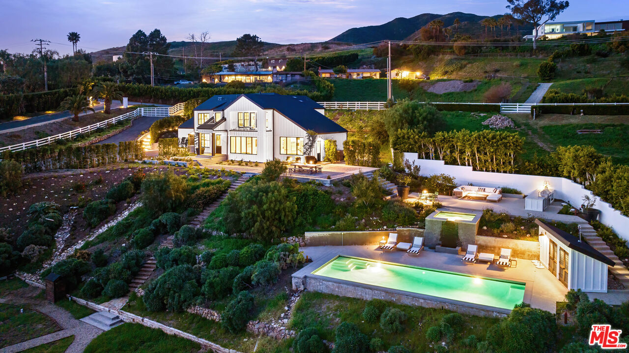 a view of swimming pool with outdoor seating and yard