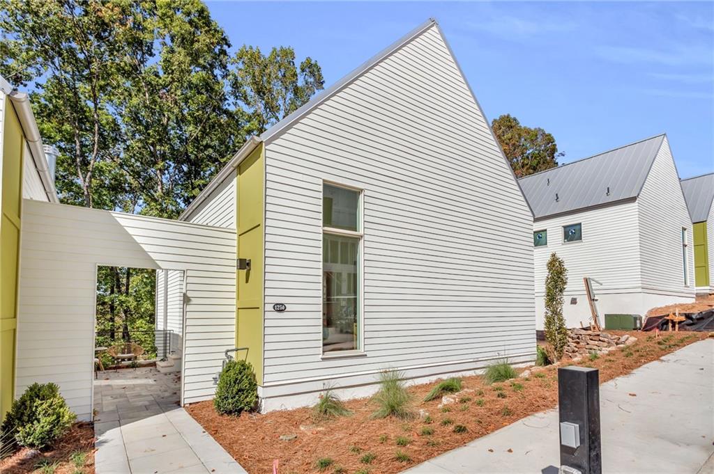 a view of a house with a backyard